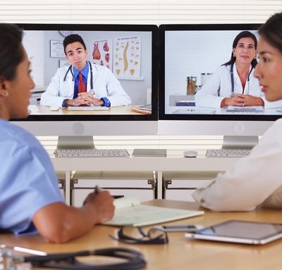 Female doctors on a video conference call with colleagues