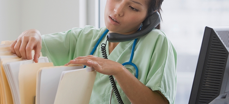 Doctor talking on telephone