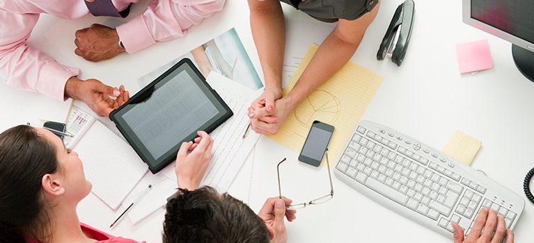 Employees looking at a tablet