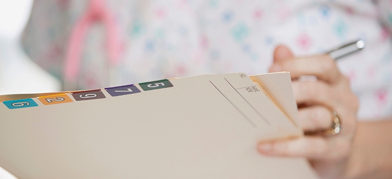 Nurse holding file