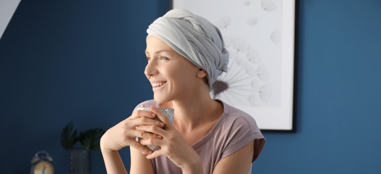 Female chemotherapy patient enjoying a cup of tea after undergoing treatment