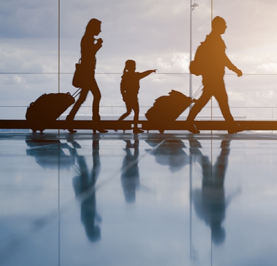 Family walking with Luggage in airport 