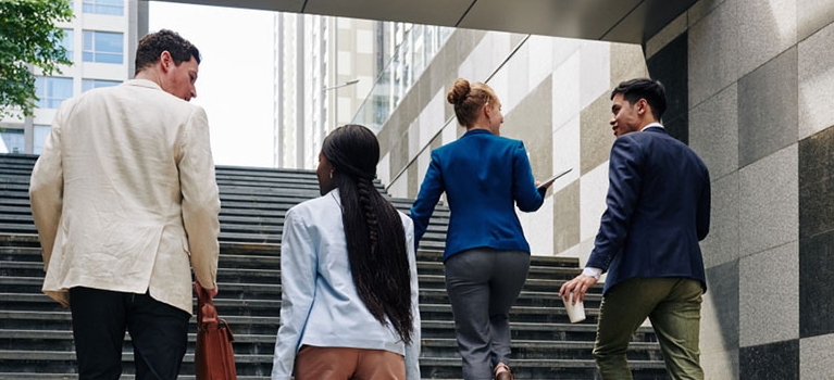 Business people walking up the stairs when going to work