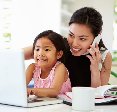 Mother working from home with daughter