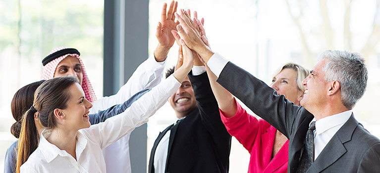 Business people giving high fives