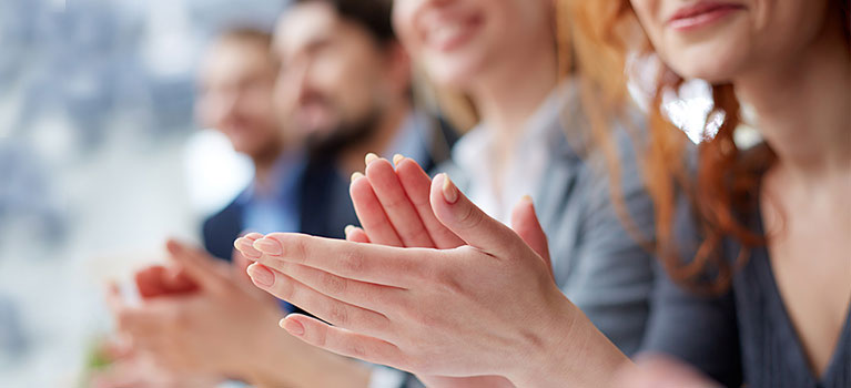 Business people clapping hands