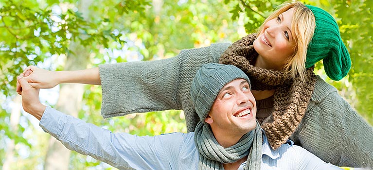 Man and Woman holding hands outside in nature