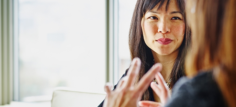 woman looking in mirror