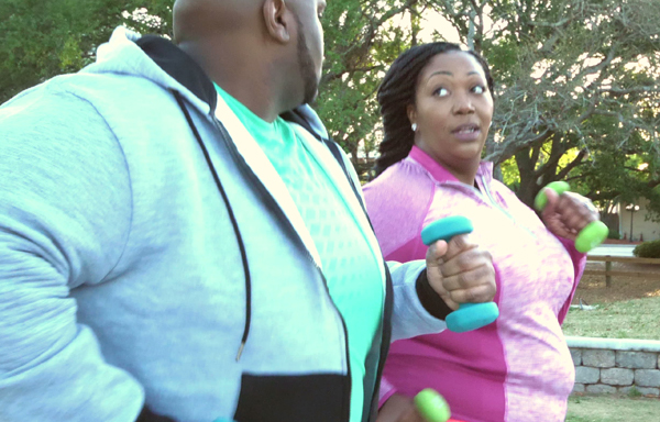 Man and woman exercising outside