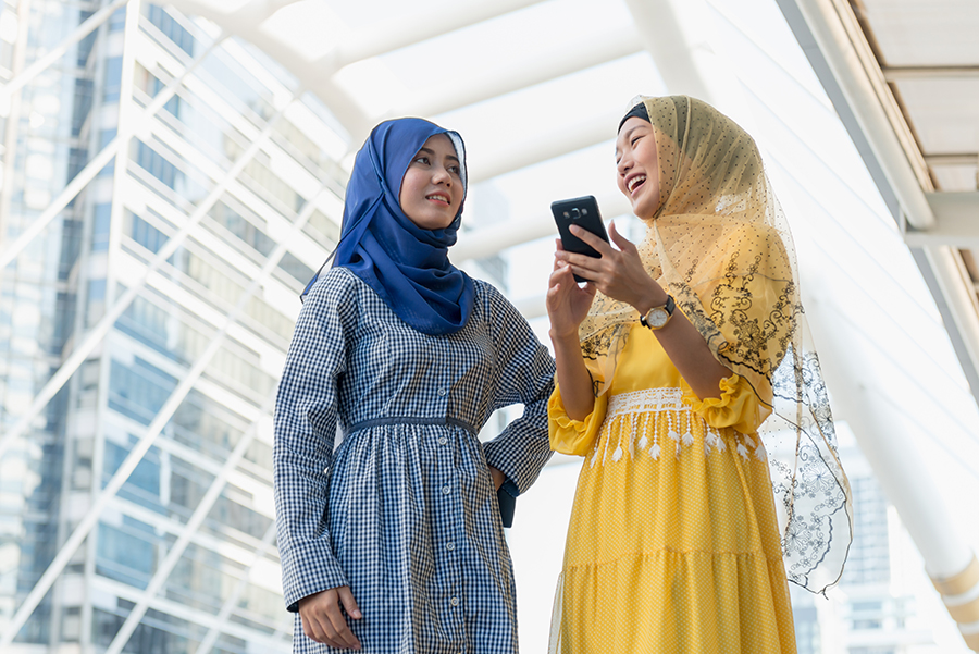 Two women outside smiling