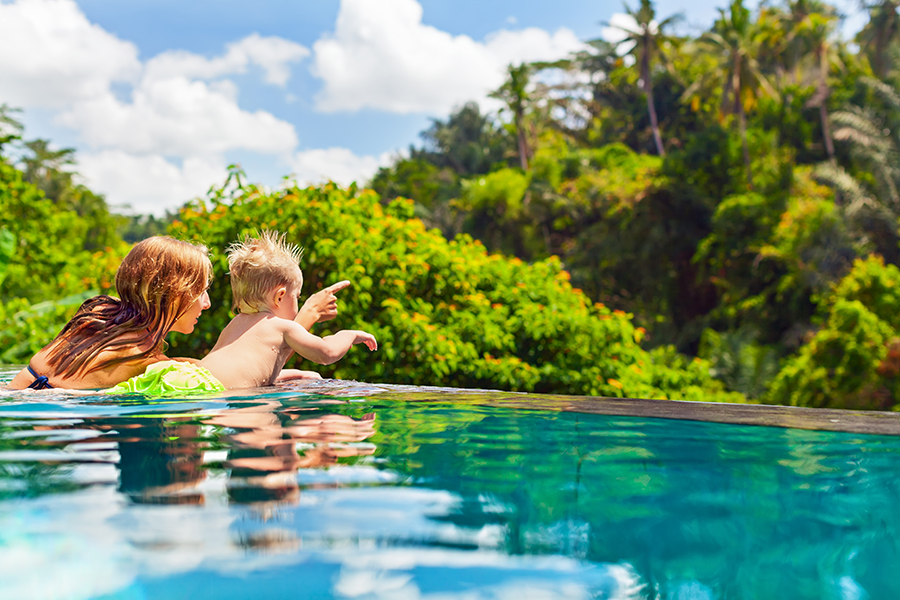 Woman and child swimming in lake