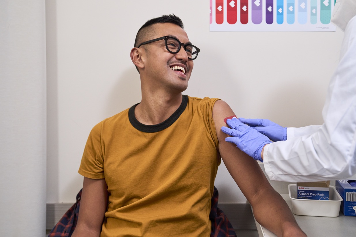 Child getting vaccination in doctor office